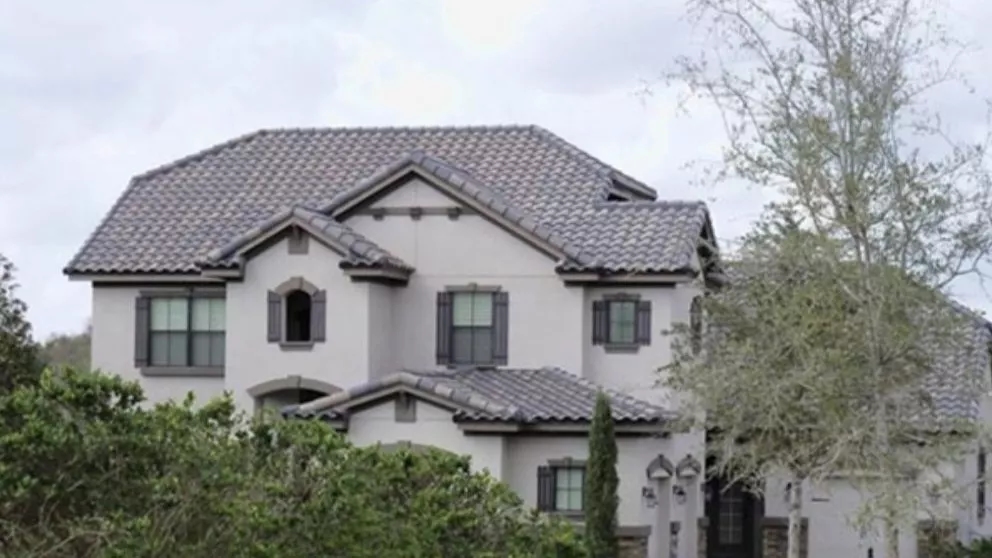 Which material is more suitable for a sloping roof?